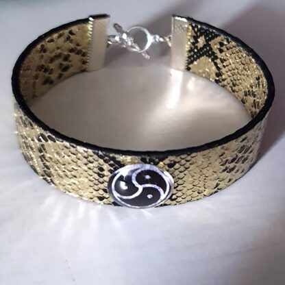 Steampunk BDSM jewelry bracelet with triskele