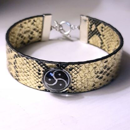 Steampunk BDSM jewelry bracelet with triskele