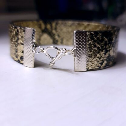 Steampunk BDSM jewelry bracelet with triskele